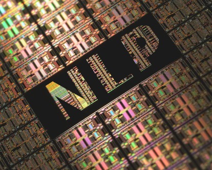 Color image of a computer motherboard with the letters NLP sitting in a black window.