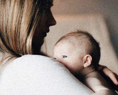 Mother holding a newborn.