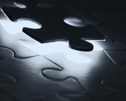 A jigsaw puzzle piece falling into place.