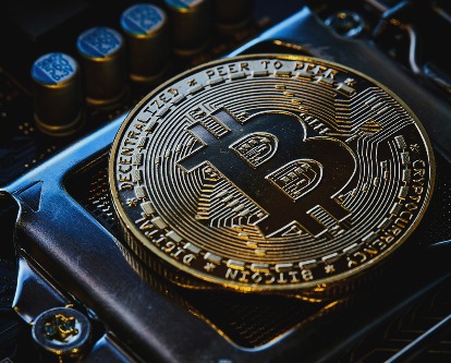 Bitcoin atop a techy desktop.