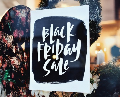 A sign reading &quot;Black Friday Sale&quot; in a store window.