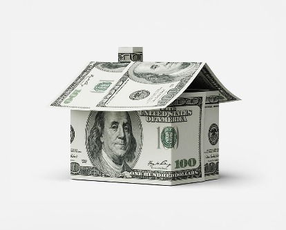 A small house made from $100 bills.