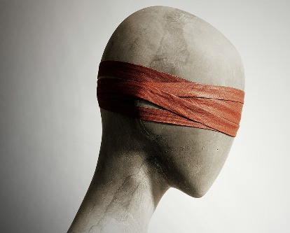 A mannequin head blindfolded.