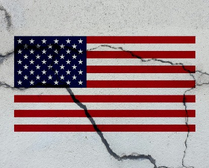 The American flag superimposed on a cracked wall.