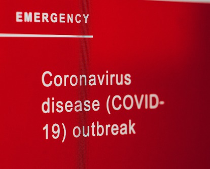 Color photograph of a Covid outbreak warning.