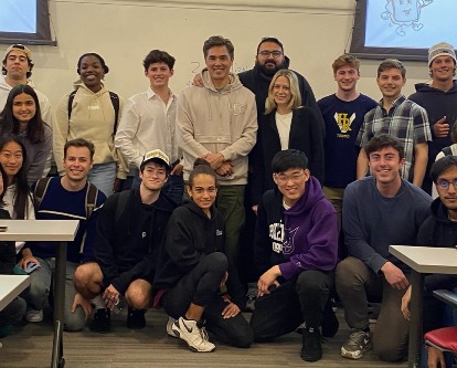 Color photograph of a group of students in a classroom at a USC Marshall course.