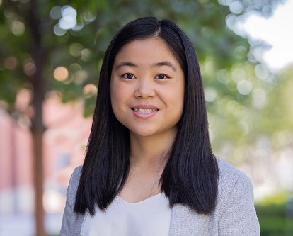 Color photograph of USC Marshall student on campus on a sunny day.