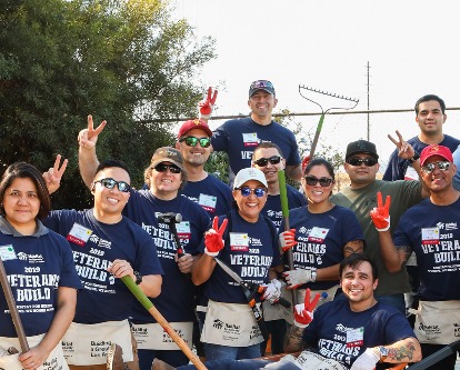 Color photograph of a group of USC Marshall students at a volunteer event for Habitat for Humanity.