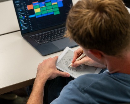 a BUAI student drawing AI models