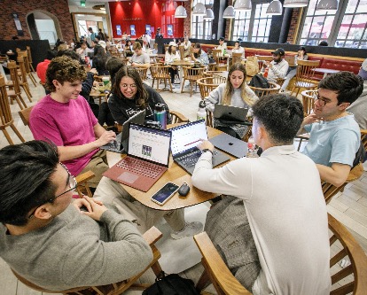 Students studying in cafeteria