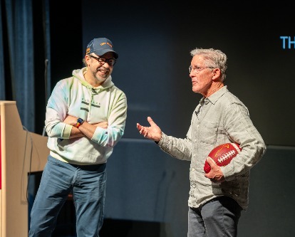 Jason Sudeikis and Pete Carroll in class