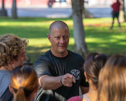 Sergeant Major John Miller chats with undergraduate students