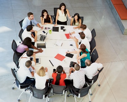 Overhead shot of a team of executives at a table.